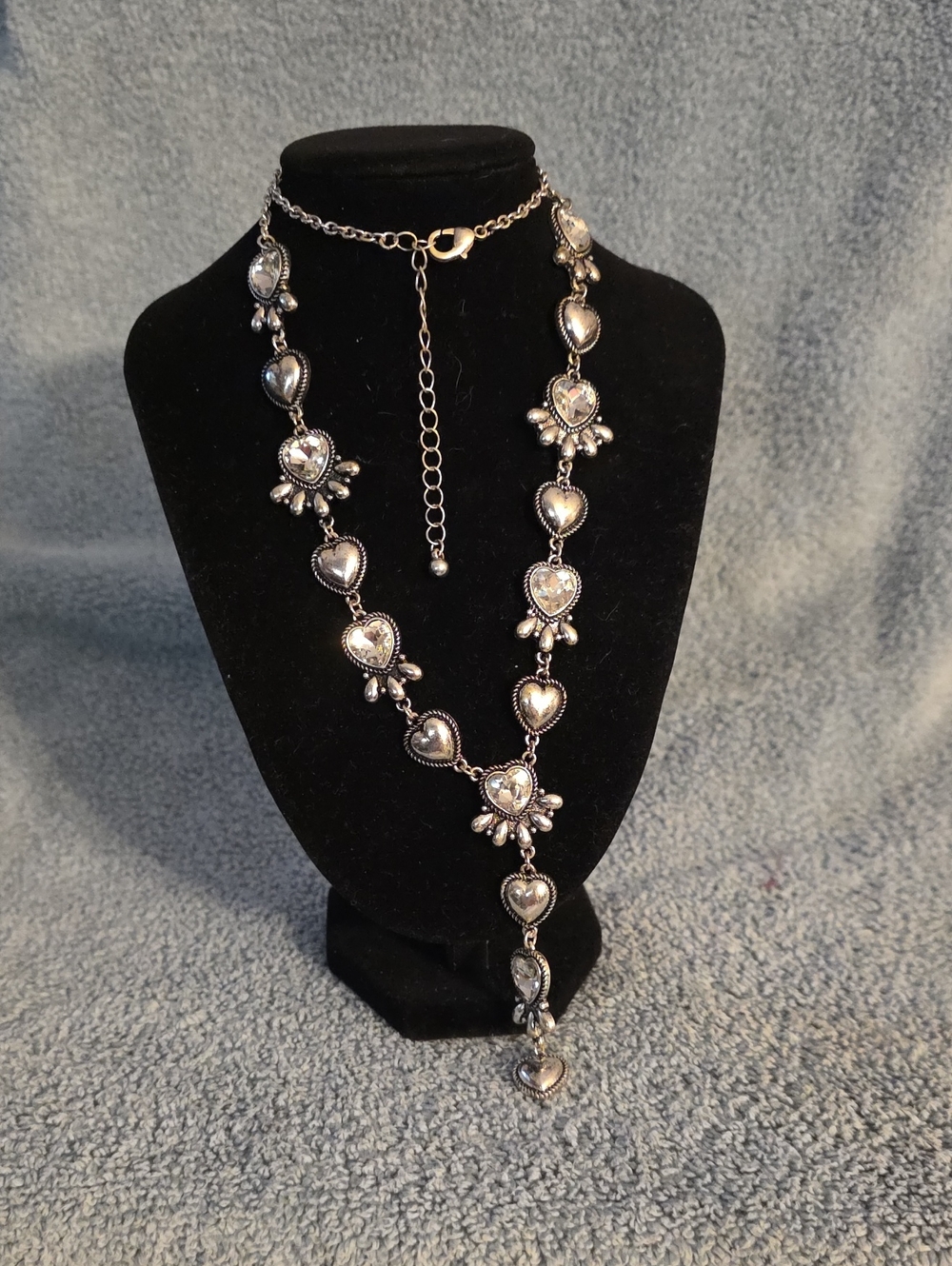 ornate, silver-tone lariat-style statement necklace